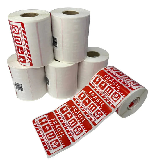 Rollos de etiquetas adhesivas rojas FRÁGIL para protección de paquetes y envíos.